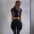 Women's leather suit with a short top and fitted pants, black, size S