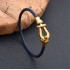 Leather cord bracelet with stainless steel horseshoe buckle, blue with gold, 21 cm