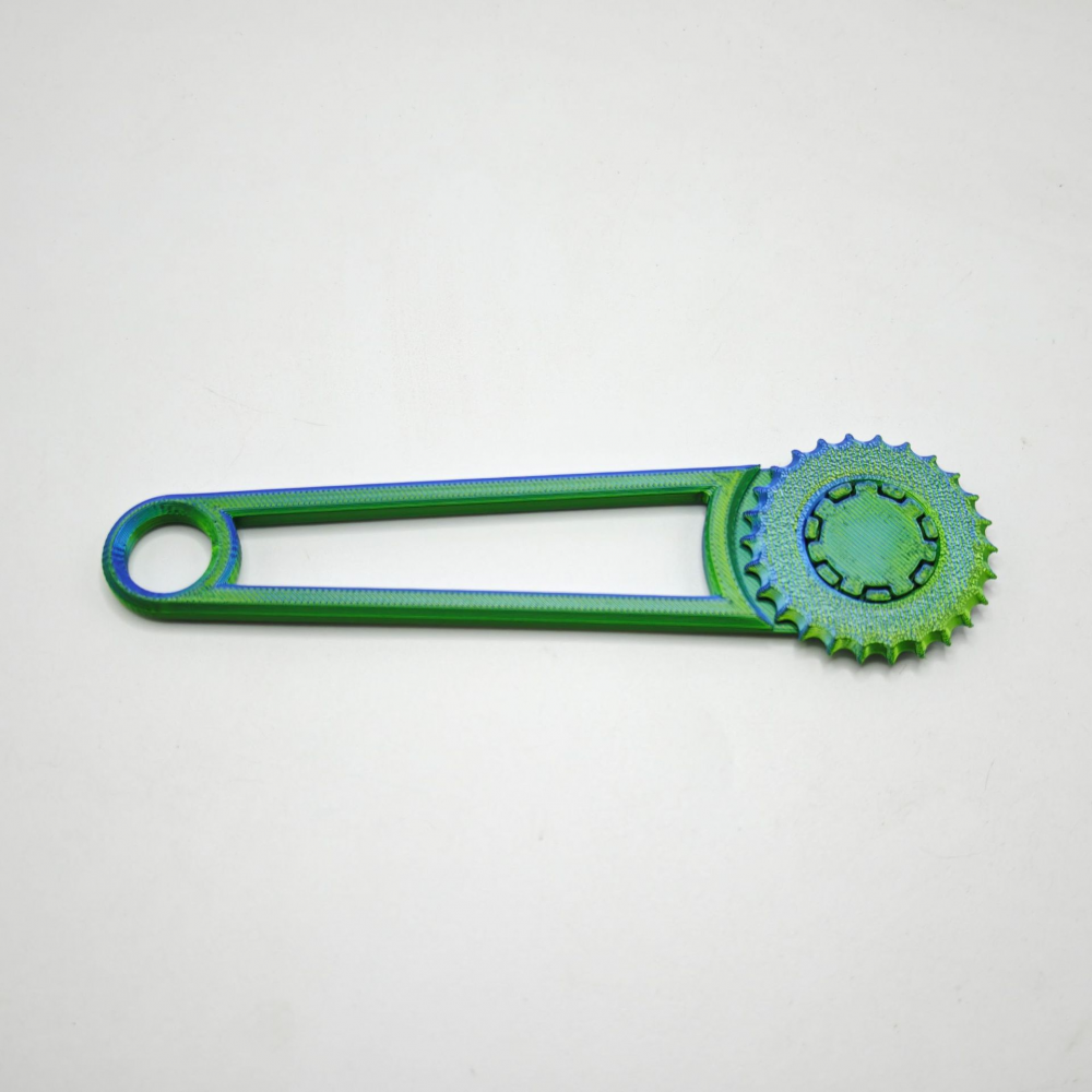 Hand tool for punching holes in cardboard boxes, green