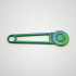 Hand tool for punching holes in cardboard boxes, green