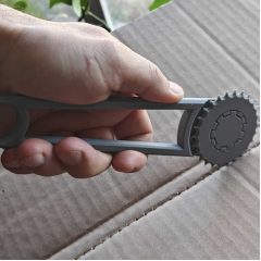 Hand tool for punching holes in cardboard boxes, green