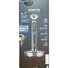 Gillette Labs heated razor with 1 handle, 2 cartridges, and a charging device.