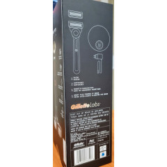 Gillette Labs heated razor with 1 handle, 2 cartridges, and a charging device.