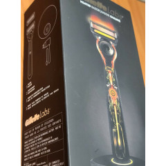 Gillette Labs heated razor with 1 handle, 2 cartridges, and a charging device.