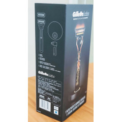 Gillette Labs heated razor with 1 handle, 2 cartridges, and a charging device.