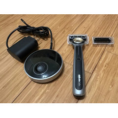 Gillette Labs Heated Razor electric shaver with 1 used razor, 2 new replacement blades, and charging dock