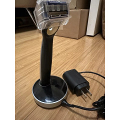 Gillette Labs Heated Razor electric shaver with 1 used razor, 2 new replacement blades, and charging dock