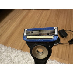 Gillette Labs Heated Razor electric shaver with 1 used razor, 2 new replacement blades, and charging dock