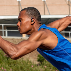 Wireless headphones JLab JBuds Air Sport with a charging case.